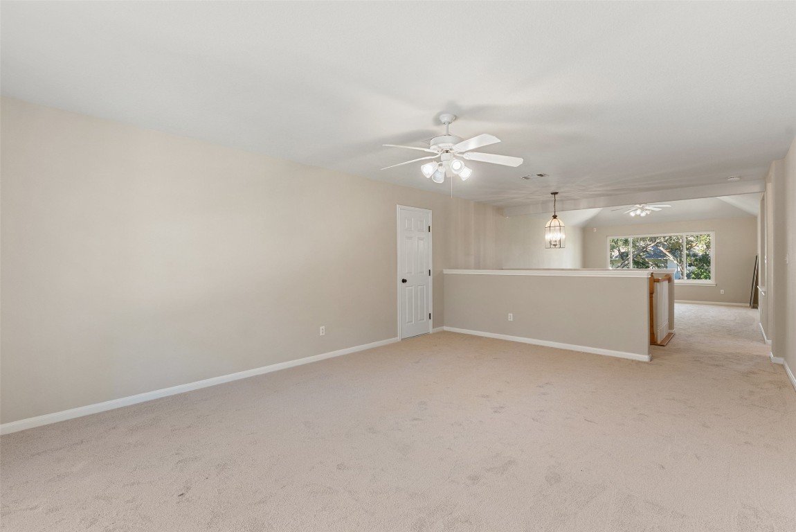 2932 Grimes Ranch Road Austin, TX 78732 - Photo 8 of 38 wooden floor in an empty room with a window