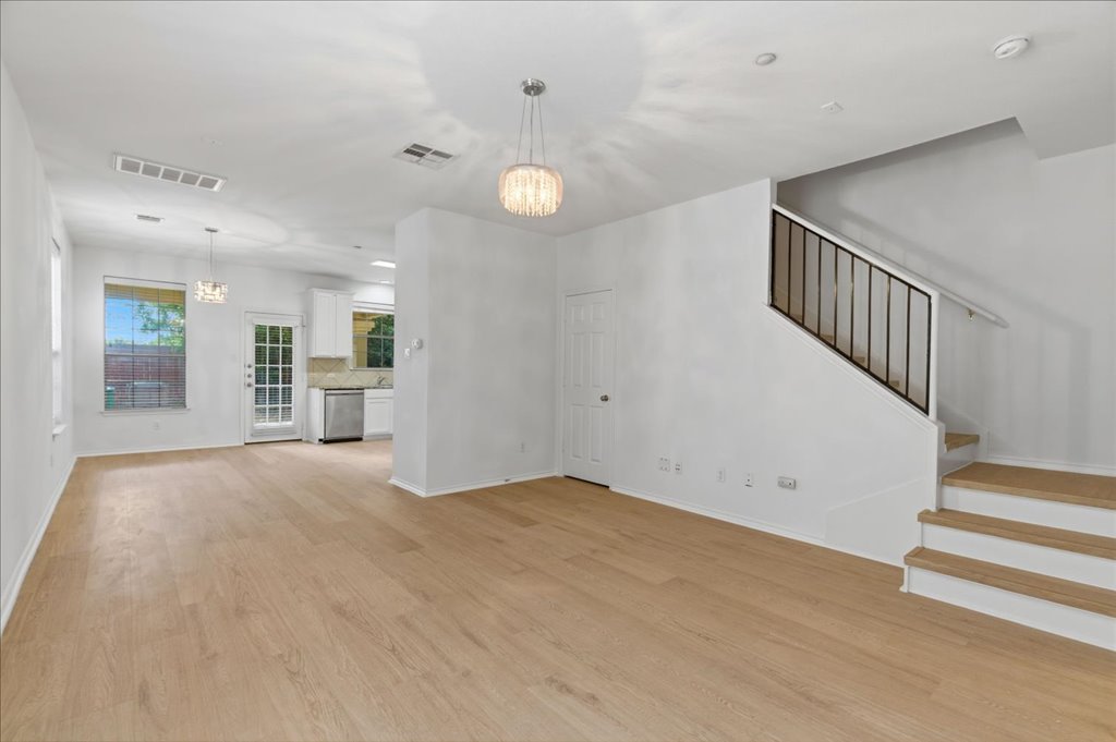 14815 Avery Ranch Boulevard, Unit 302 Austin, TX 78717 - Photo 13 of 30 an empty room with wooden floor and windows