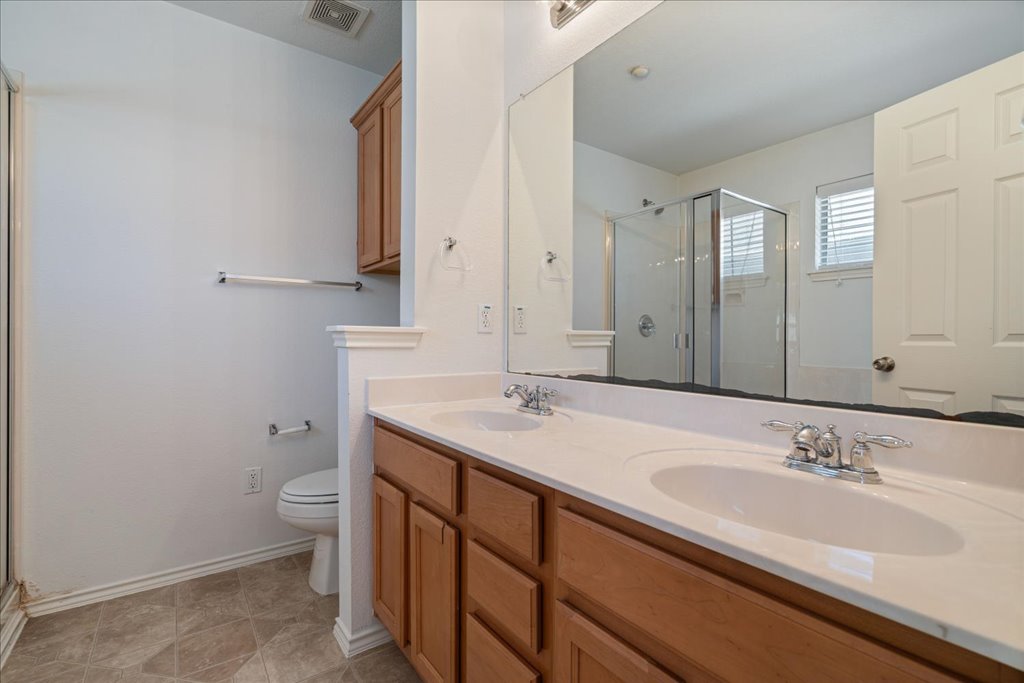 14815 Avery Ranch Boulevard, Unit 302 Austin, TX 78717 - Photo 19 of 30 a bathroom with a sink and a toilet