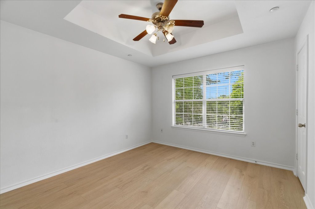 14815 Avery Ranch Boulevard, Unit 302 Austin, TX 78717 - Photo 21 of 30 an empty room with a window and a fan