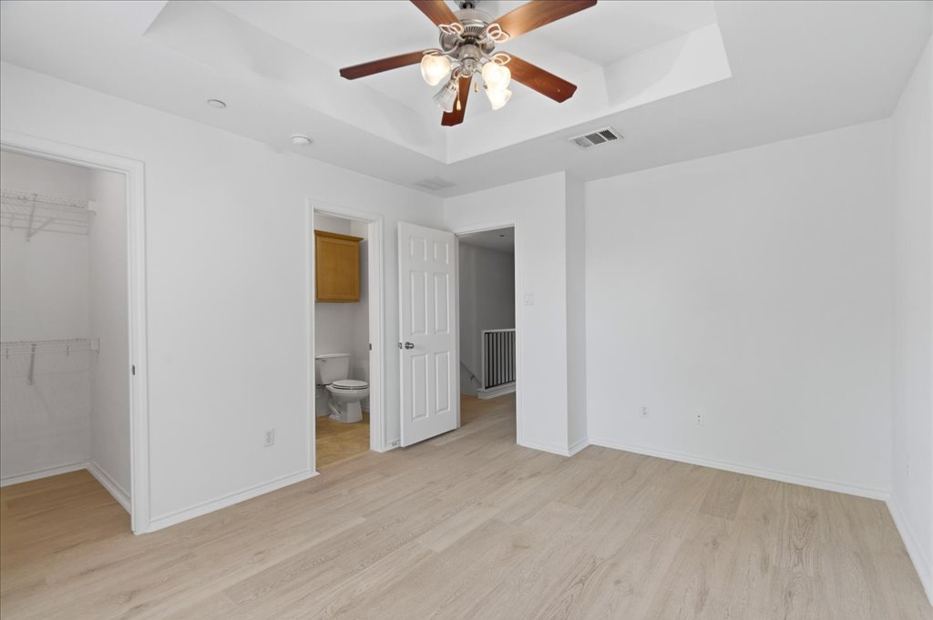 14815 Avery Ranch Boulevard, Unit 302 Austin, TX 78717 - Photo 22 of 30 a view of an empty room and chandelier fan