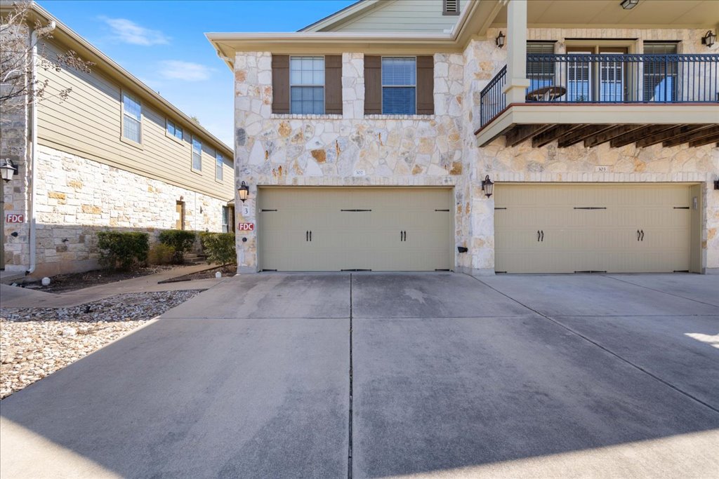 14815 Avery Ranch Boulevard, Unit 302 Austin, TX 78717 - Photo 4 of 30 a view of a house with a yard