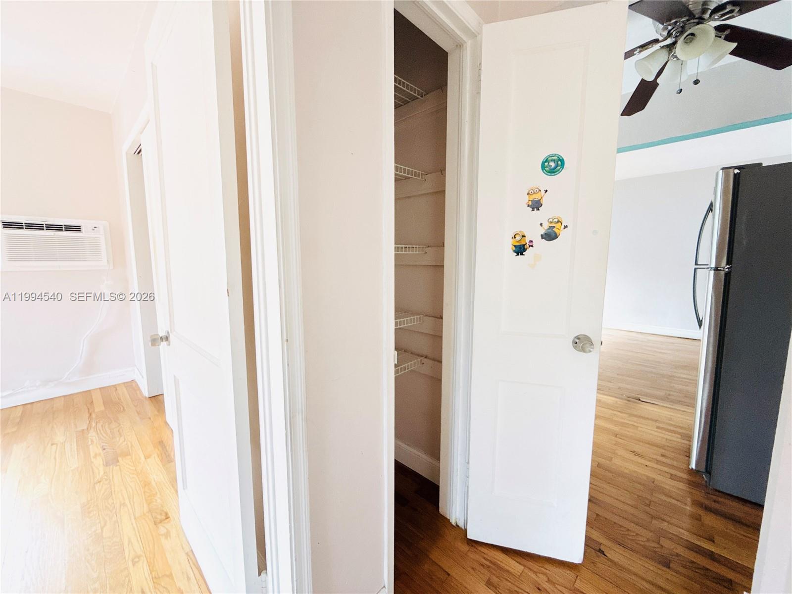 555 Southwest 16th Avenue, Unit 11 Miami, FL 33135 - Photo 12 of 18 a view of hallway with wooden floor