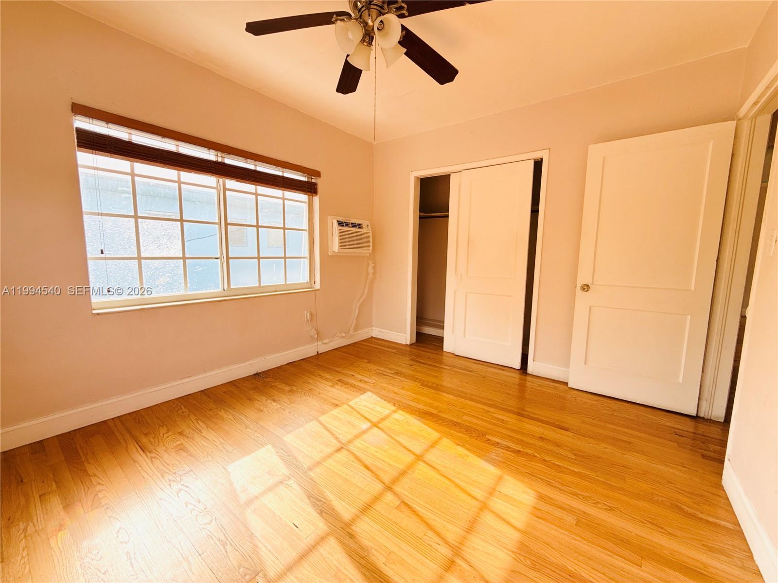 555 Southwest 16th Avenue, Unit 11 Miami, FL 33135 - Photo 14 of 18 a view of an empty room with a window