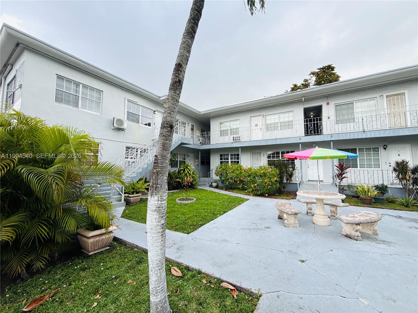 555 Southwest 16th Avenue, Unit 11 Miami, FL 33135 - Photo 17 of 18 a front view of a house with garden