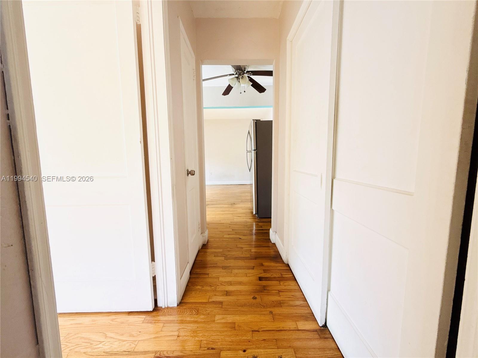 555 Southwest 16th Avenue, Unit 11 Miami, FL 33135 - Photo 9 of 18 a view of a hallway with wooden floor