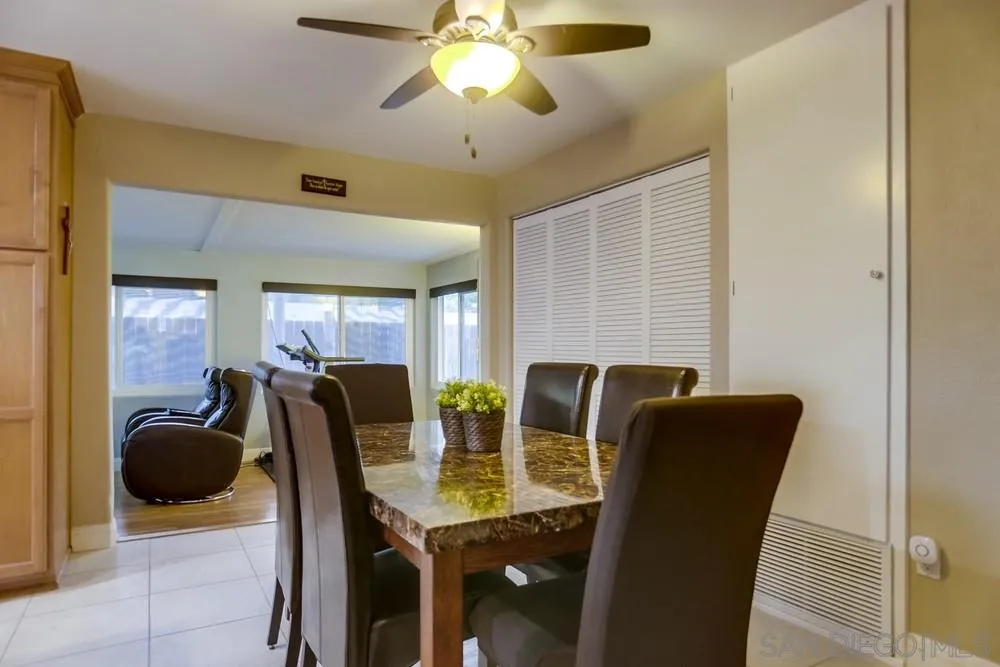 13626 Carriage Road Poway, CA 92064 - Photo 6 of 25 a view of a dining room with furniture and chandelier