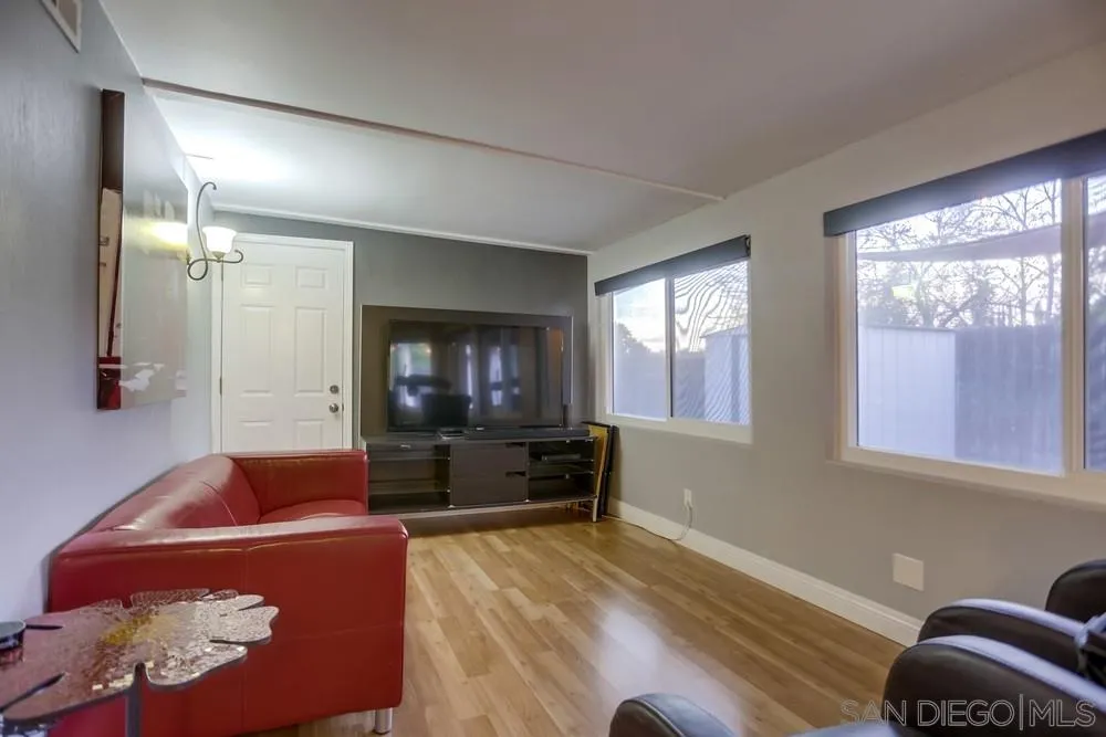 13626 Carriage Road Poway, CA 92064 - Photo 9 of 25 a living room with furniture and a flat screen tv