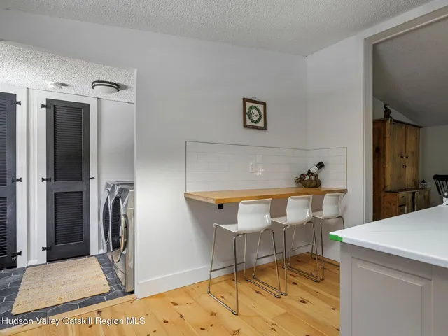 a kitchen with cabinets a sink and appliances