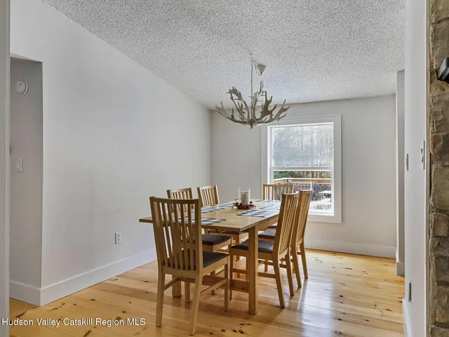 a bedroom with a bed and a lamp