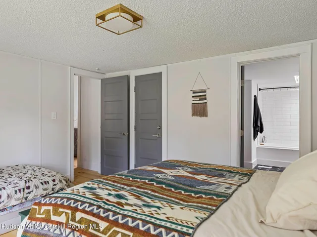 a bedroom with a bed and a cabinets