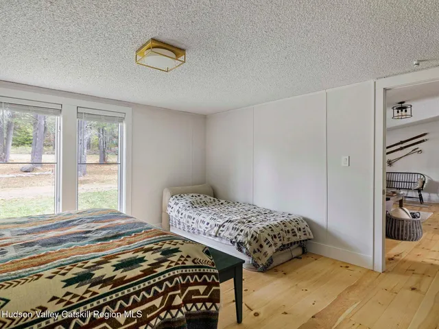 a bathroom with a double vanity sink mirror and shower