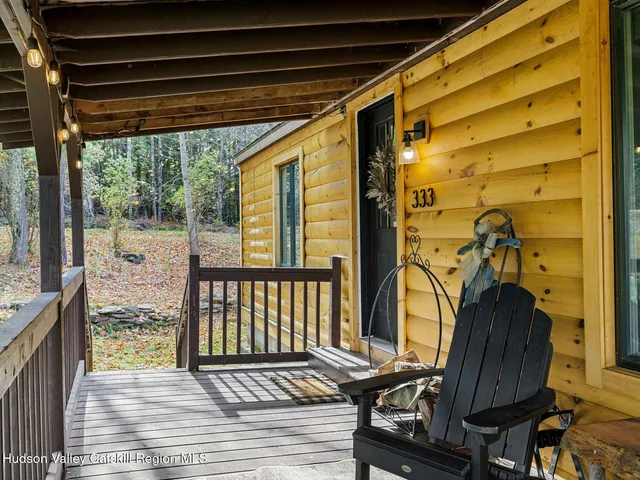 a view of a balcony with furniture