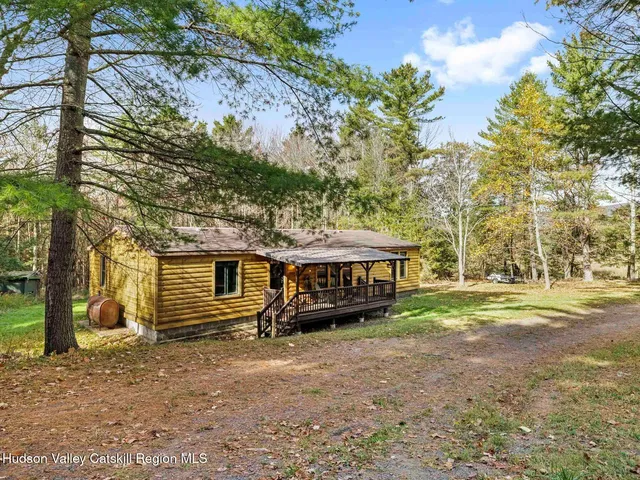 a view of a wooden deck with furniture
