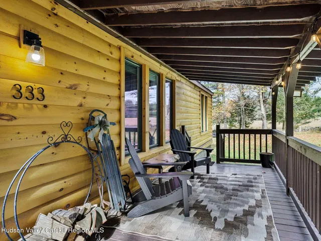 a view of porch with a bench