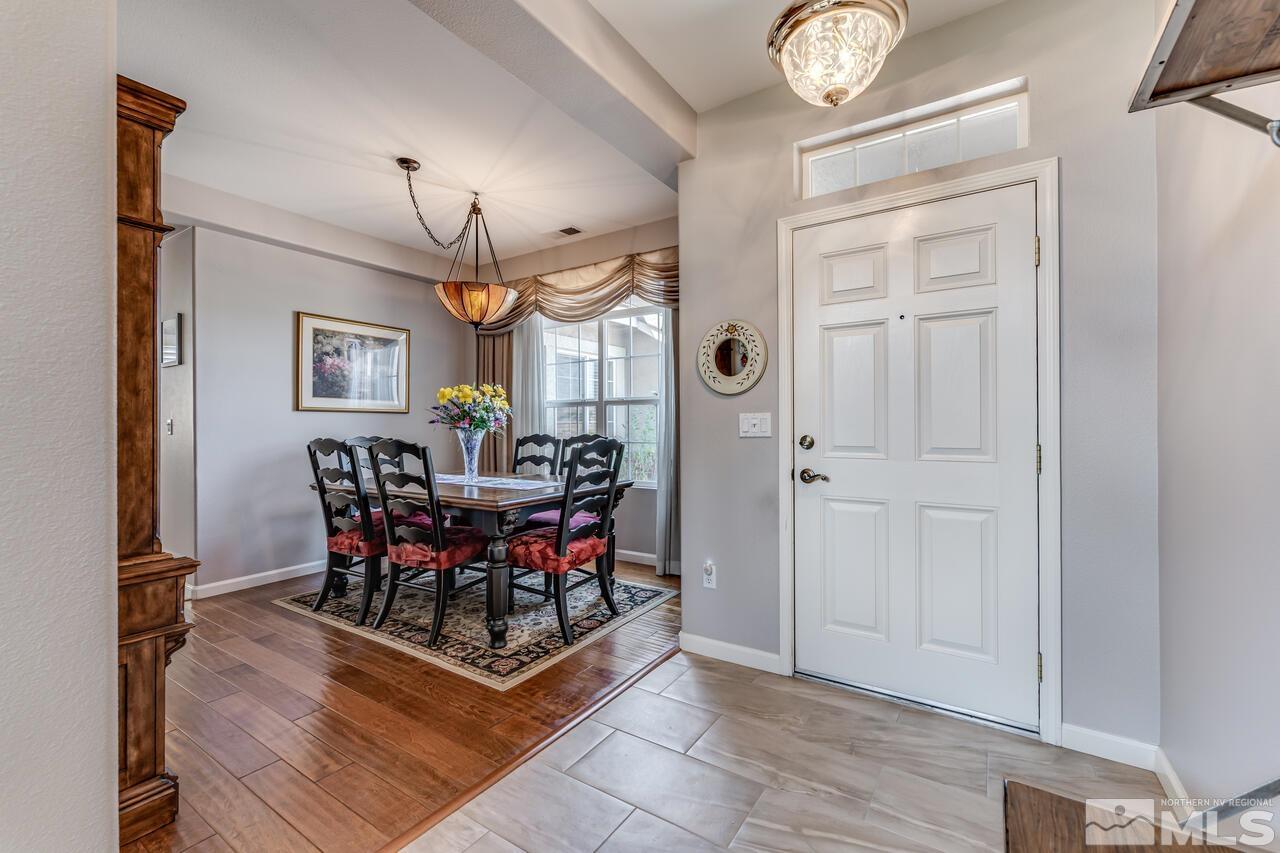 10650 Silver Cliff Way Reno, NV 89521 - Photo 2 of 38 a view of a dining room with furniture and chandelier