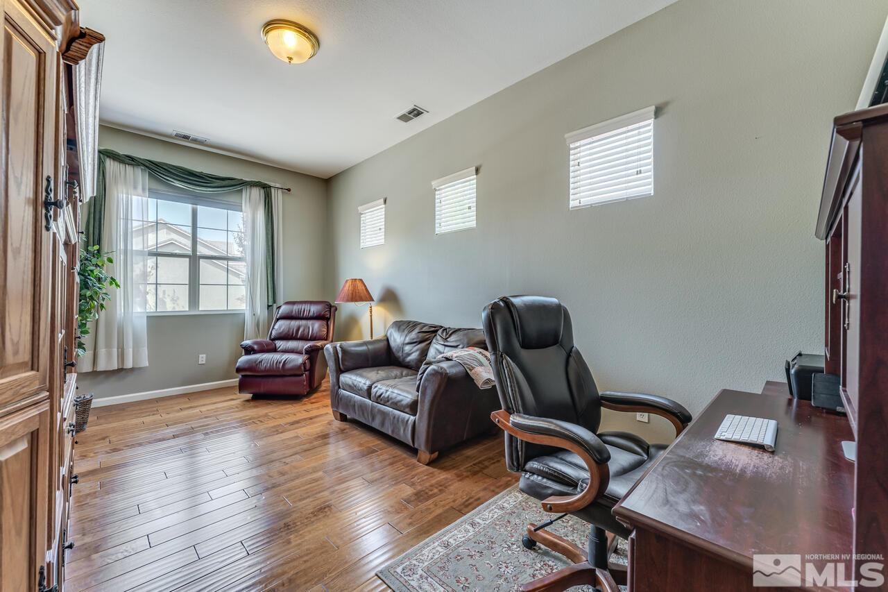 10650 Silver Cliff Way Reno, NV 89521 - Photo 21 of 38 a livingroom with workspace and a window