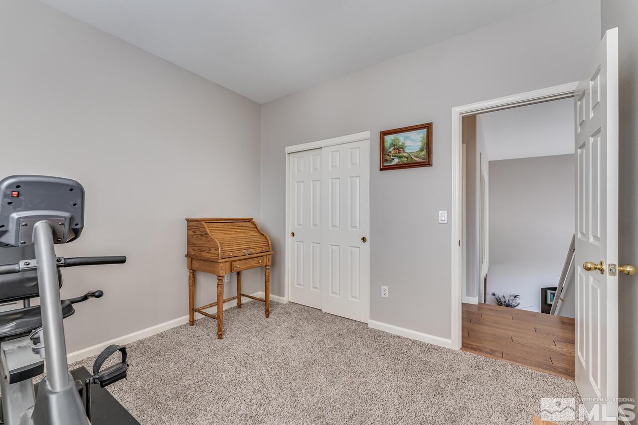 10650 Silver Cliff Way Reno, NV 89521 - Photo 25 of 38 a view of a hallway with workspace