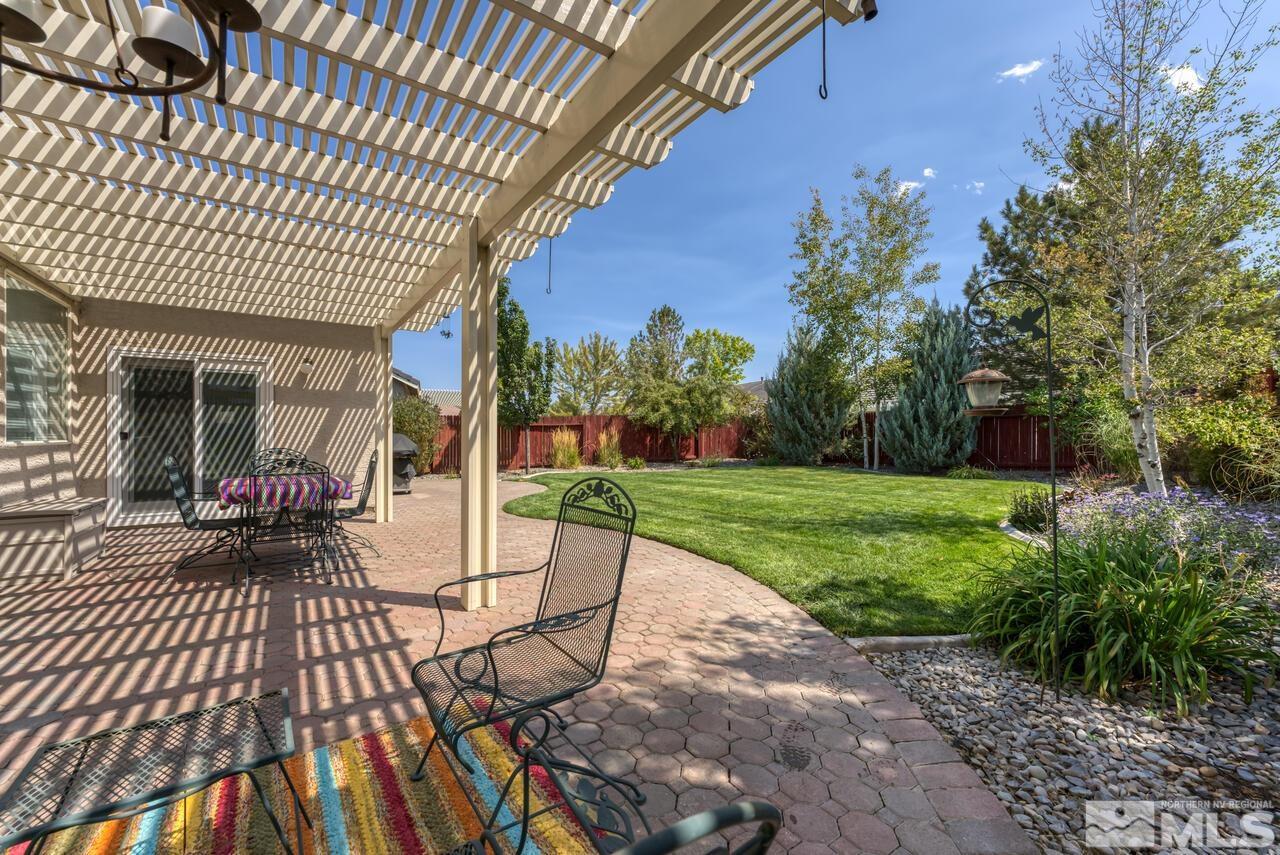 10650 Silver Cliff Way Reno, NV 89521 - Photo 34 of 38 a view of a porch with furniture and garden