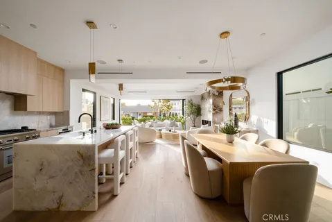 a large kitchen with stainless steel appliances lots of counter top space