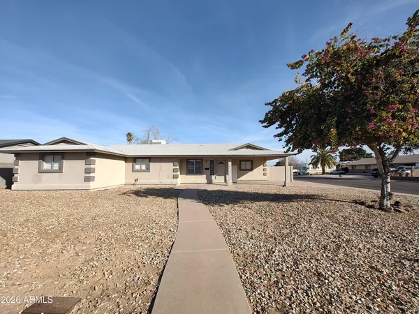 front view of a house with a yard