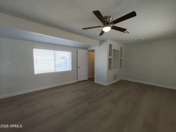 a view of an empty room with a window