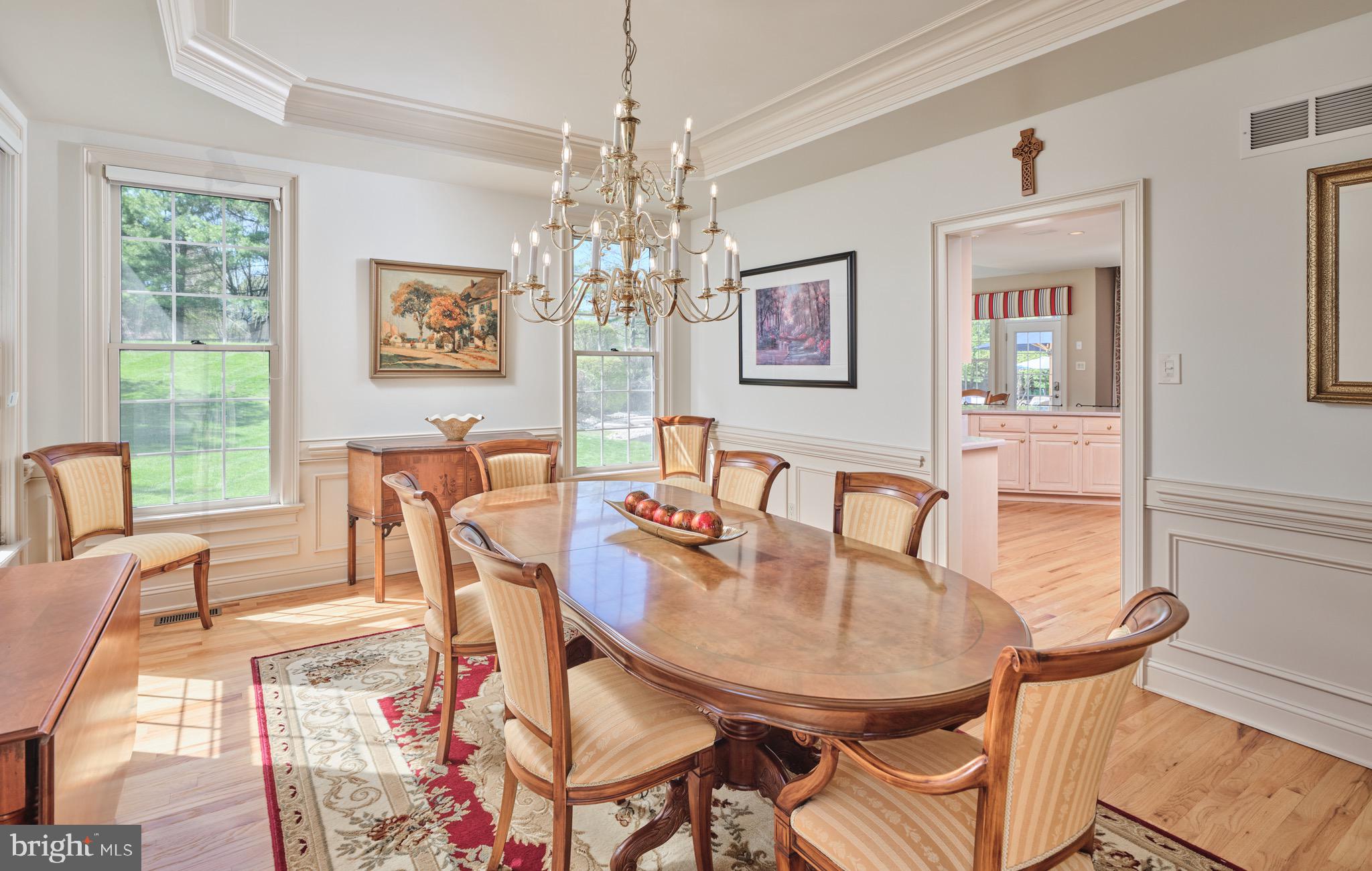 37 Alexanders Court Newtown, PA 18940 - Photo 17 of 50 a view of a dining room with furniture a chandelier and wooden floor