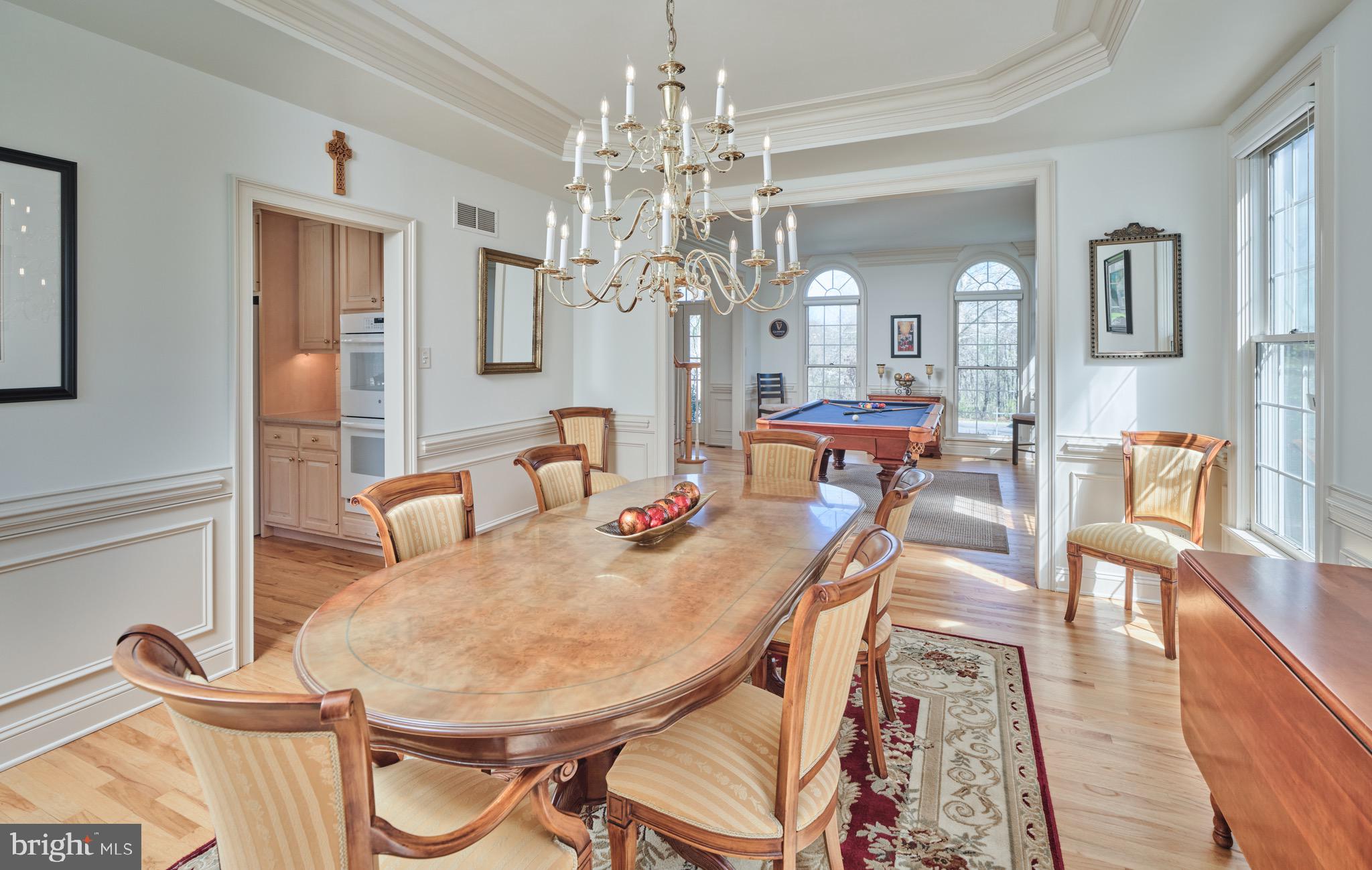 37 Alexanders Court Newtown, PA 18940 - Photo 18 of 50 a view of a dining room with furniture and chandelier