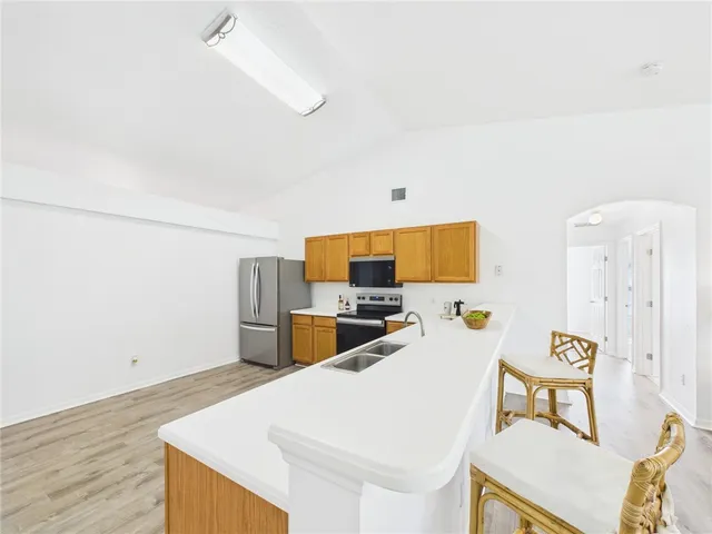 a living room with a bed furniture and a table