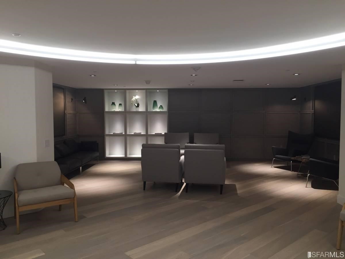 338 Main Street, Unit 27D San Francisco, CA 94105 - Photo 12 of 24 a living room with furniture and a lamp