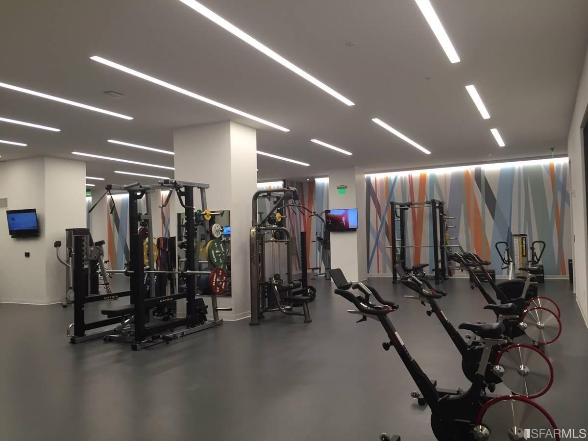 338 Main Street, Unit 27D San Francisco, CA 94105 - Photo 18 of 24 a view of a room with gym equipment