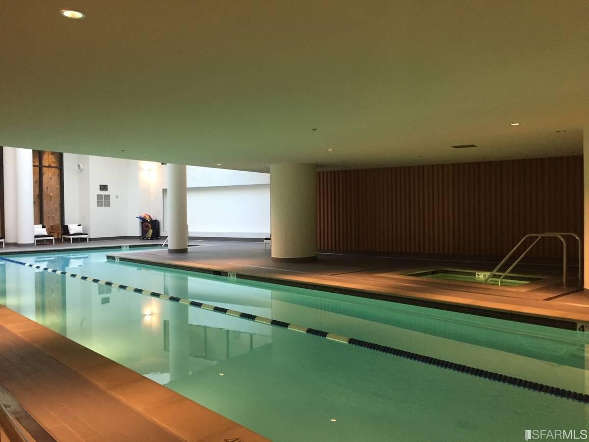 338 Main Street, Unit 27D San Francisco, CA 94105 - Photo 19 of 24 a bathroom with a sink and a large mirror