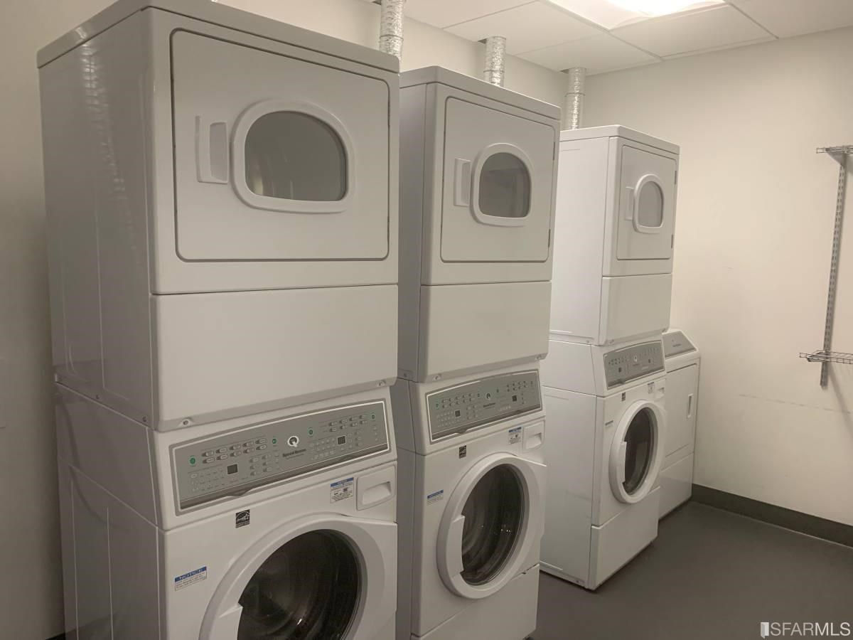 338 Main Street, Unit 27D San Francisco, CA 94105 - Photo 22 of 24 a utility room with dryer and washer