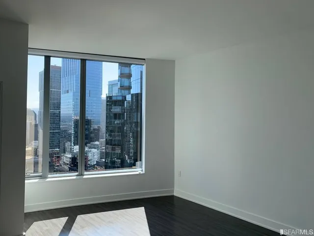a kitchen with a sink and a large window