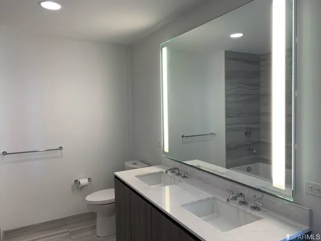 a bathroom with a bathtub and shower