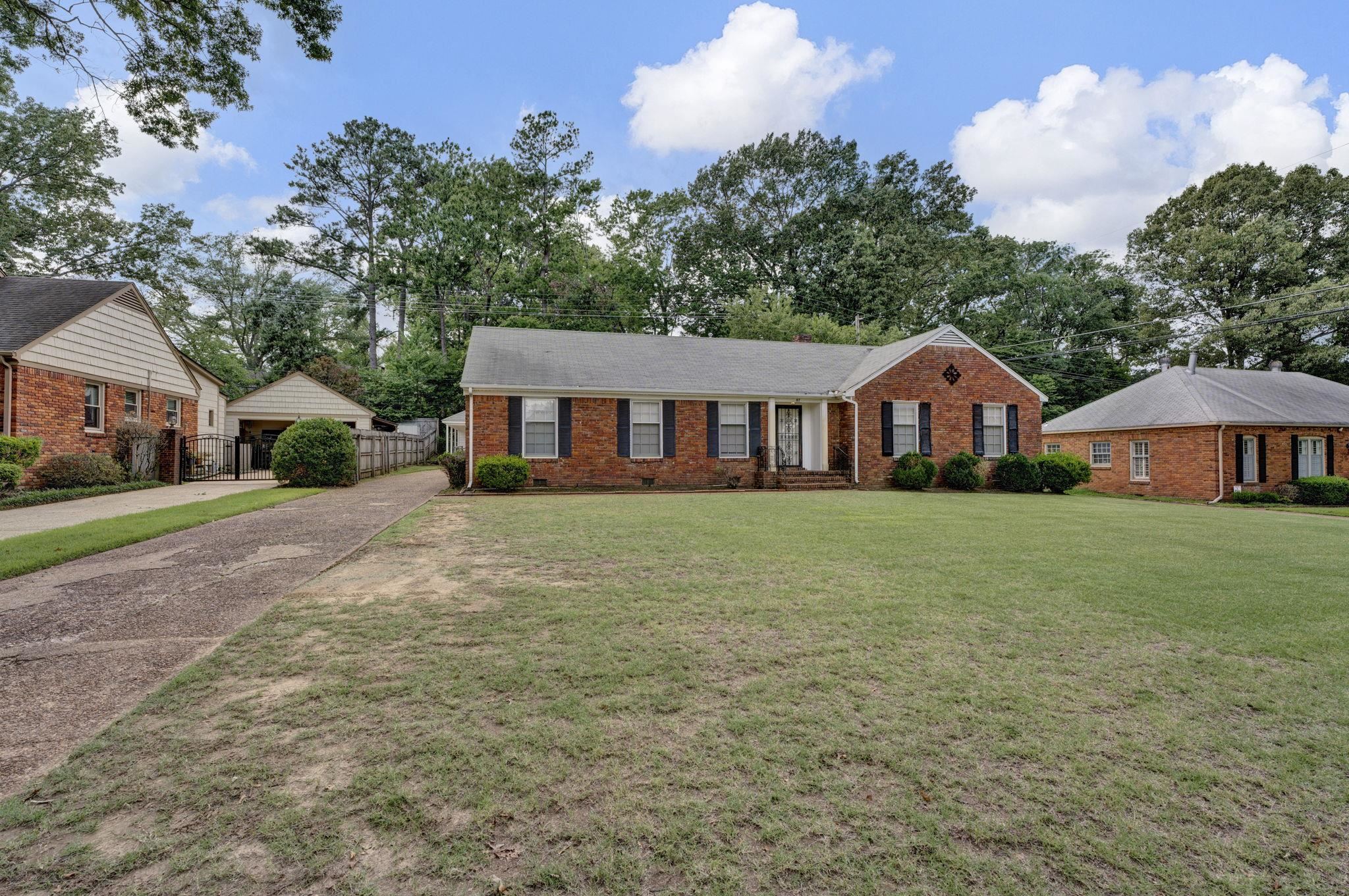 87 North Oak Grove Road Memphis, TN 38120 - Photo 25 of 25 a front view of a house with garden