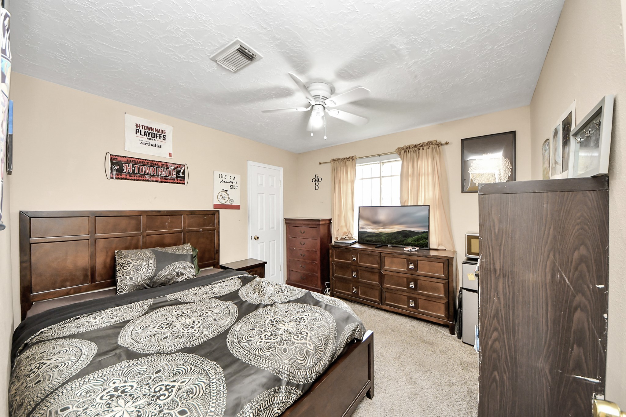 4155 Amir Street Houston, TX 77072 - Photo 33 of 43 a bedroom with a bed and wooden floor