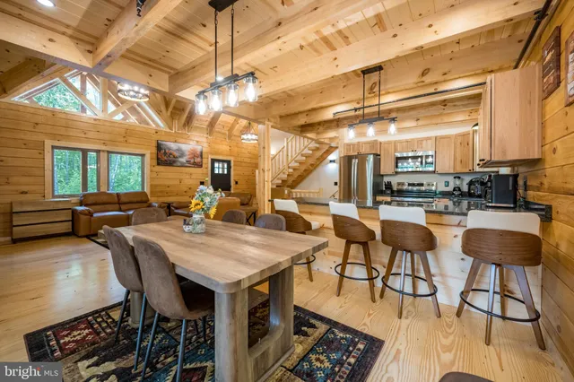 a kitchen with granite countertop a sink appliances and cabinets