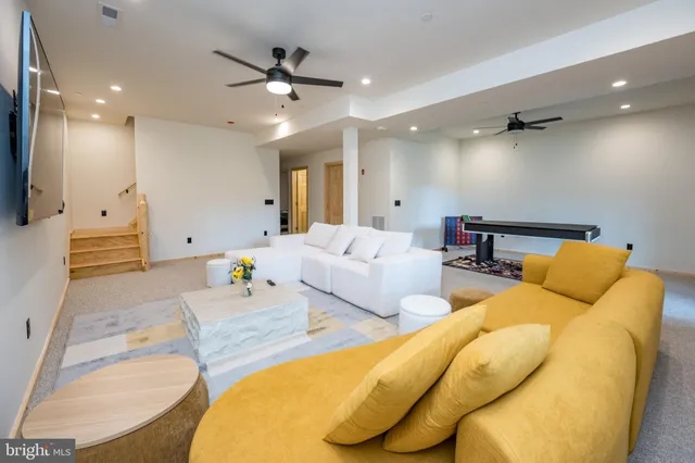 a view of a lush green forest with trees and some houses