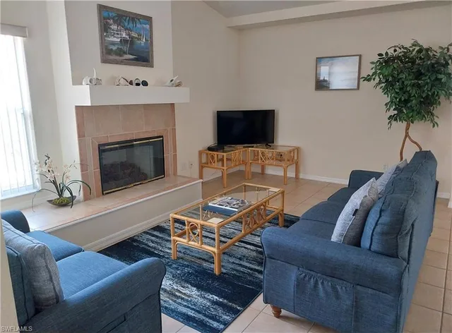 a bedroom with a bed and a mirror