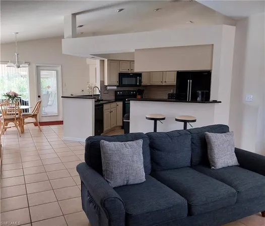 a bedroom with a bed and a large mirror