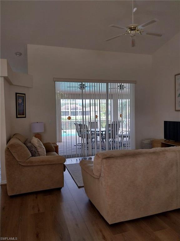 449 Dundee Court Naples, FL 34104 - Photo 5 of 35 a living room with furniture and a flat screen tv