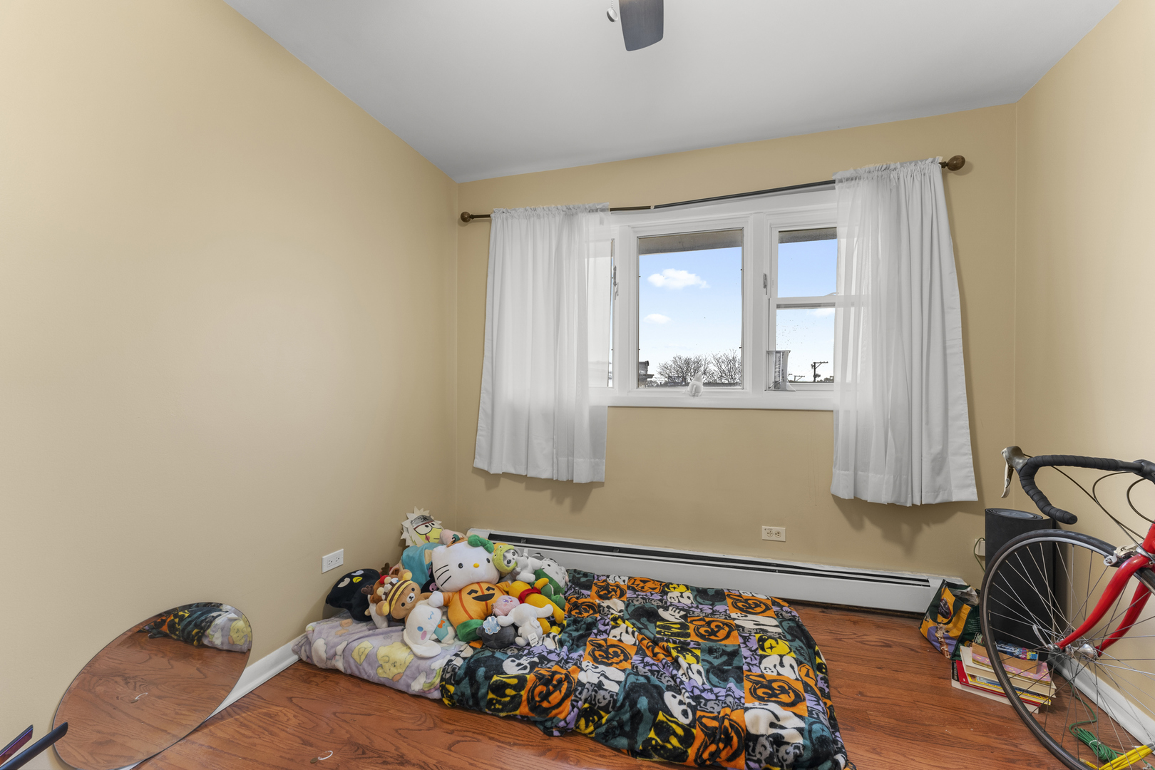 5121 West Diversey Avenue, Unit 3S Chicago, IL 60639 - Photo 7 of 9 a bed room with a bed and a window