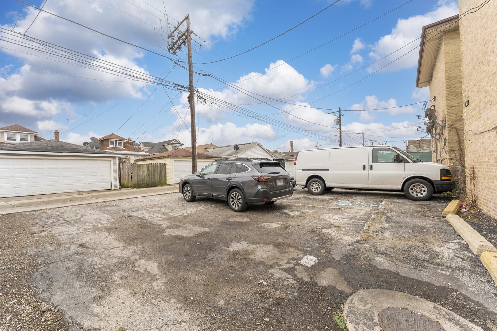 5121 West Diversey Avenue, Unit 3S Chicago, IL 60639 - Photo 8 of 9 a view of a city street with cars
