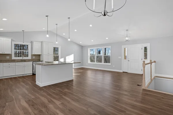 a view of kitchen with cabinets and wooden floor