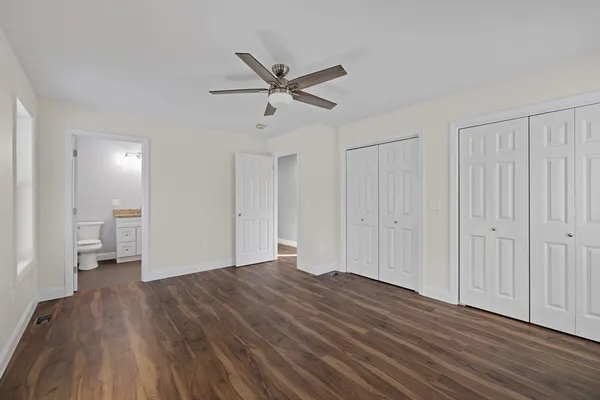 a bathroom with a granite countertop sink a shower and a mirror