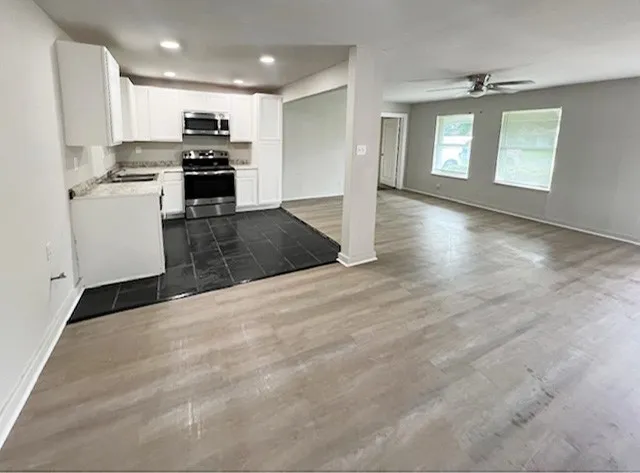 a view of a kitchen with furniture and a kitchen