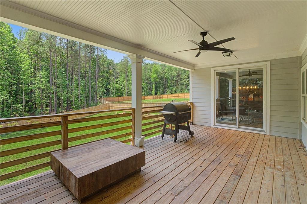 376 Hunnicut Road Southeast Mableton, GA 30126 - Photo 48 of 73 a view of a wooden deck with a bench