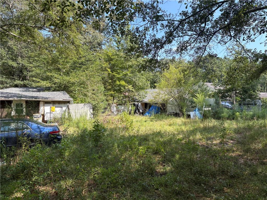 6355 Kimberly Mill Road South Fulton, GA 30349 - Photo 14 of 68 a backyard of a house with lots of green space