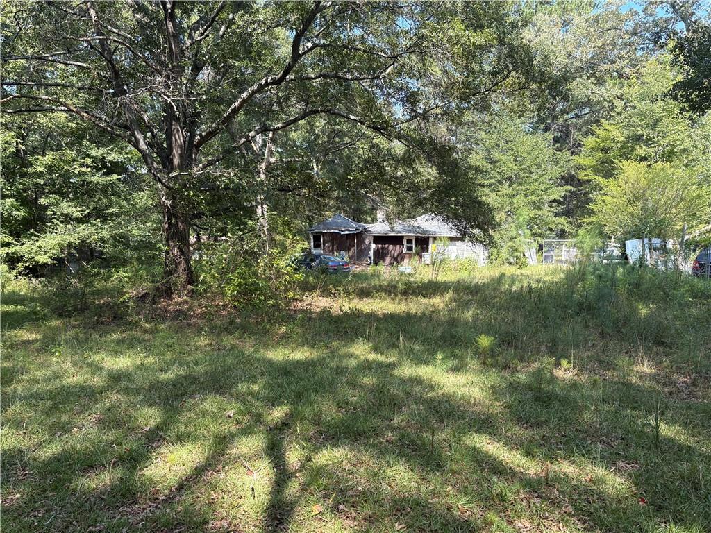 6355 Kimberly Mill Road South Fulton, GA 30349 - Photo 2 of 68 a backyard of a house with table and chairs